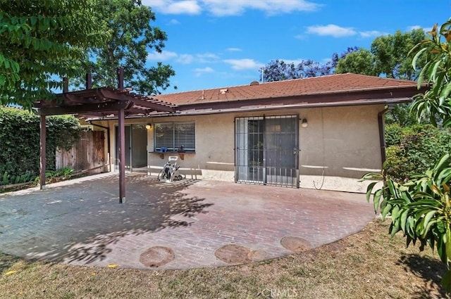 2747 Persimmon Pl, Riverside, CA 92506 - back of house featuring stucco siding, a pergola, and a patio