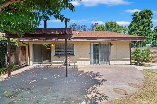 2747 Persimmon Pl, Riverside, CA 92506 - back of house with stucco siding, a pergola, and a patio area