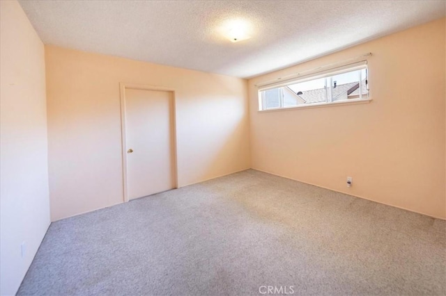 11815 Rimrock Dr, La Mirada, CA 90638 - carpeted empty room with a textured ceiling