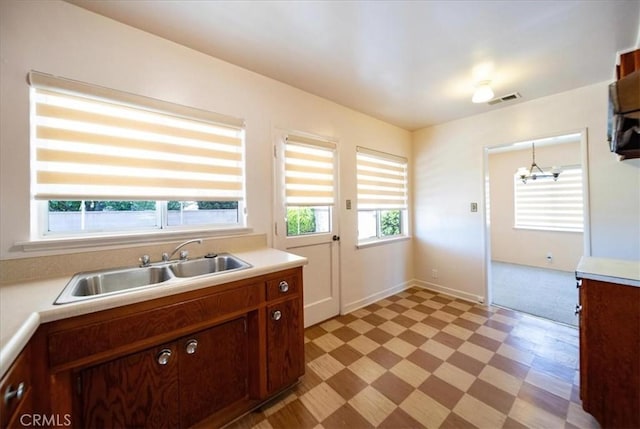11815 Rimrock Dr, La Mirada, CA 90638 - kitchen with light flooring, light countertops, and a chandelier