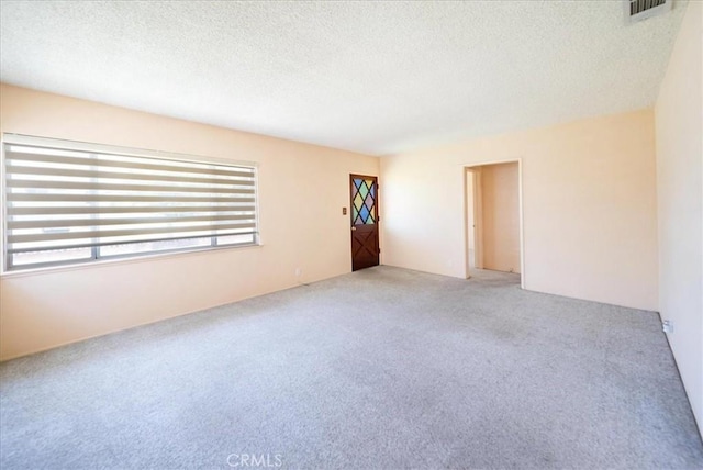 11815 Rimrock Dr, La Mirada, CA 90638 - spare room featuring light carpet and a textured ceiling