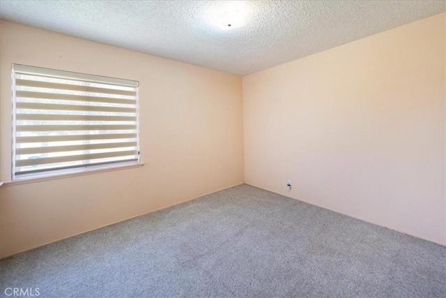 11815 Rimrock Dr, La Mirada, CA 90638 - carpeted empty room with a textured ceiling