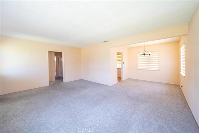 11815 Rimrock Dr, La Mirada, CA 90638 - spare room with a chandelier, healthy amount of natural light, and carpet flooring