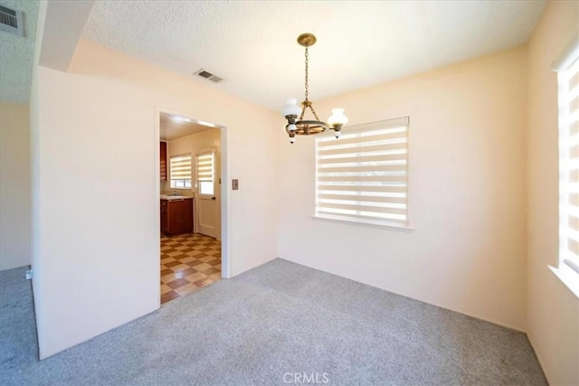11815 Rimrock Dr, La Mirada, CA 90638 - carpeted spare room with a chandelier