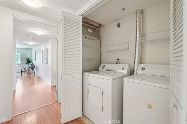 6221 Monterey Rd Unit 402, Los Angeles, CA 90042 - laundry area featuring washing machine and dryer and light wood-type flooring