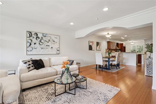 6221 Monterey Rd Unit 402, Los Angeles, CA 90042 - living area with arched walkways, recessed lighting, ornamental molding, and wood finished floors