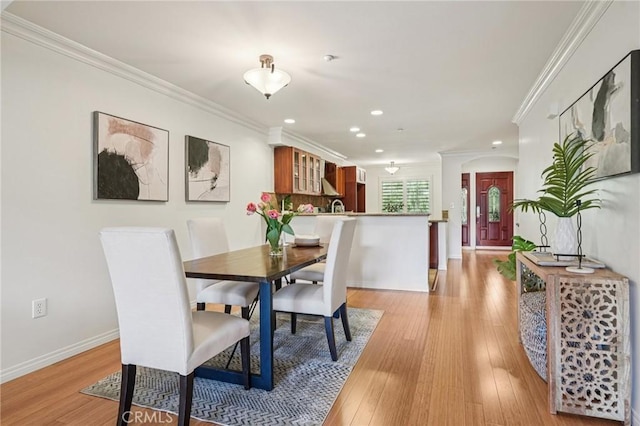 6221 Monterey Rd Unit 402, Los Angeles, CA 90042 - dining room with ornamental molding, recessed lighting, and light wood-type flooring