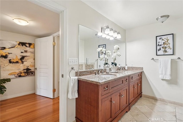 6221 Monterey Rd Unit 402, Los Angeles, CA 90042 - full bathroom with double vanity and wood finished floors