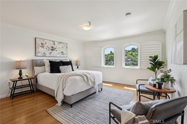 6221 Monterey Rd Unit 402, Los Angeles, CA 90042 - bedroom featuring crown molding and light wood-style flooring