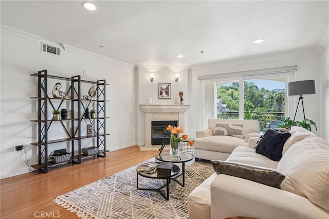 6221 Monterey Rd Unit 402, Los Angeles, CA 90042 - living room featuring ornamental molding, wood finished floors, a high end fireplace, and recessed lighting