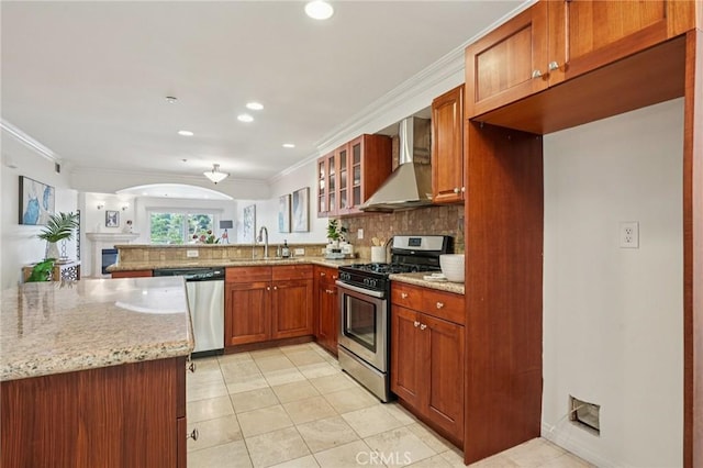 6221 Monterey Rd Unit 402, Los Angeles, CA 90042 - kitchen with appliances with stainless steel finishes, wall chimney exhaust hood, decorative backsplash, light stone counters, and light tile patterned flooring