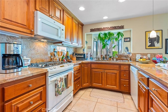 6351 Gloria Dr, Huntington Beach, CA 92647 - kitchen with white appliances, brown cabinetry, backsplash, light tile patterned floors, and recessed lighting