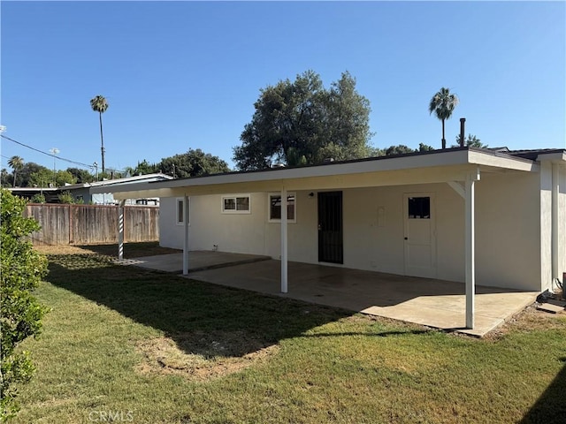 3055 Ronald St, Riverside, CA 92506 - rear view of property with a patio, stucco siding, and a carport