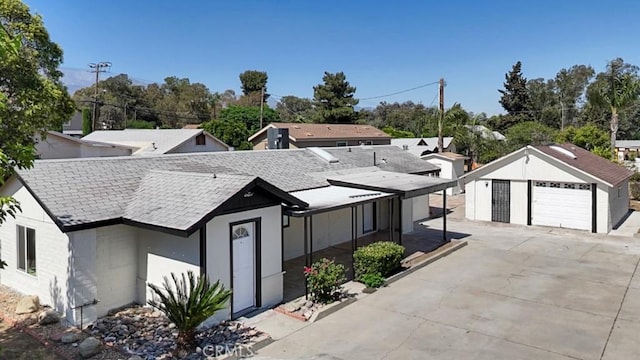 156 N Sunset Ave, Banning, CA 92220 - view of front of home with a detached garage and roof with shingles