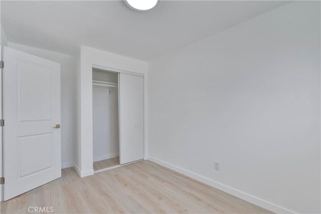 156 N Sunset Ave, Banning, CA 92220 - unfurnished bedroom featuring light wood-style floors and a closet