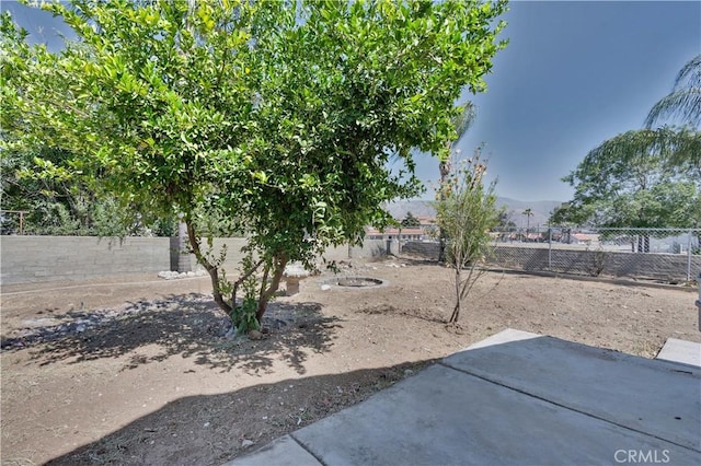 156 N Sunset Ave, Banning, CA 92220 - fenced backyard featuring a patio
