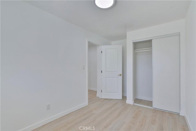 156 N Sunset Ave, Banning, CA 92220 - unfurnished bedroom featuring wood finished floors and a closet