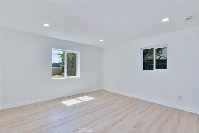 156 N Sunset Ave, Banning, CA 92220 - spare room with light wood-style floors, recessed lighting, and a smoke detector