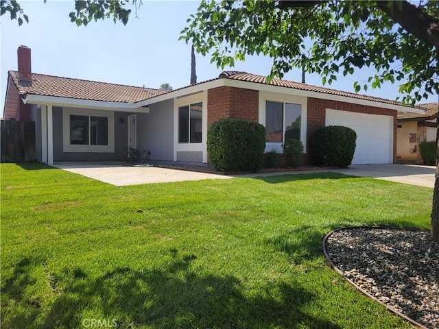 12922 Glenmere Dr, Moreno Valley, CA 92553 - view of front of house featuring a tile roof, an attached garage, concrete driveway, and stucco siding