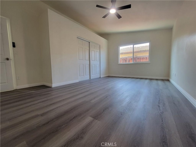 12922 Glenmere Dr, Moreno Valley, CA 92553 - unfurnished bedroom with dark wood finished floors, a closet, and a ceiling fan