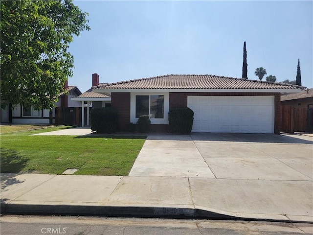 12922 Glenmere Dr, Moreno Valley, CA 92553 - ranch-style house featuring a tiled roof, a garage, and concrete driveway