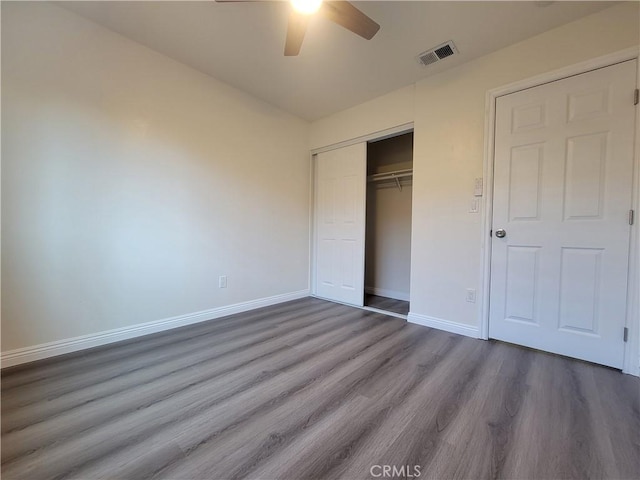 12922 Glenmere Dr, Moreno Valley, CA 92553 - unfurnished bedroom with wood finished floors, a closet, and ceiling fan