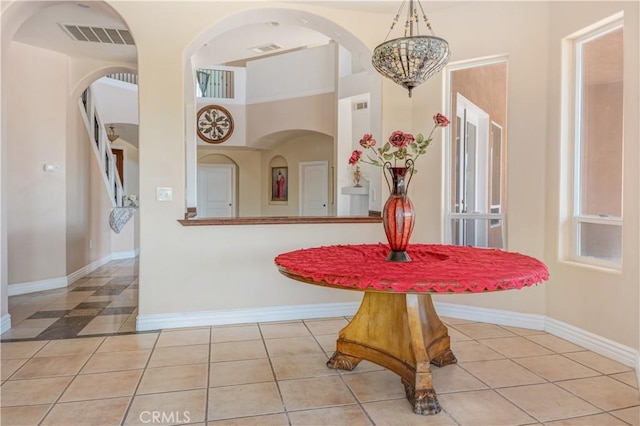 11110 Choctaw Dr, Bakersfield, CA 93308 - dining area with tile patterned flooring and arched walkways