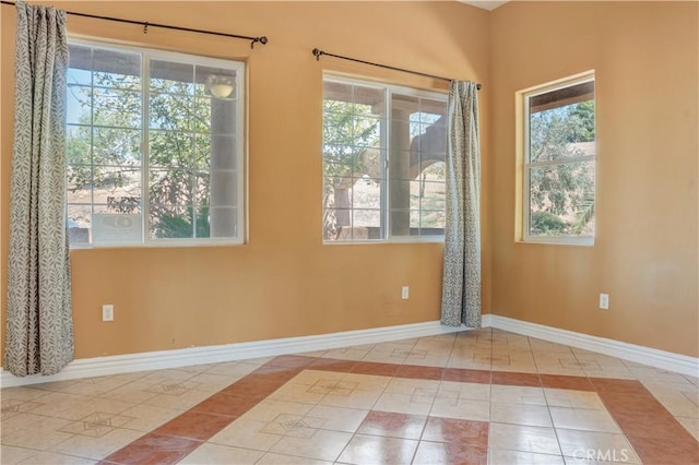 11110 Choctaw Dr, Bakersfield, CA 93308 - tiled empty room featuring baseboards and inlaid floor details