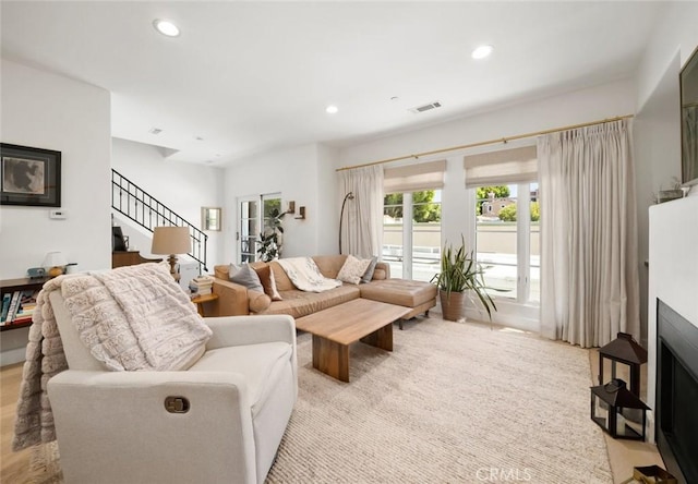 1212 Carmel St, San Luis Obispo, CA 93401 - living room with stairway, recessed lighting, wood finished floors, and a fireplace with flush hearth