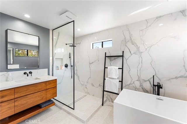 45 Morena, Irvine, CA 92612 - bathroom featuring vanity, a soaking tub, a marble finish shower, plenty of natural light, and recessed lighting