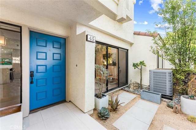 45 Morena, Irvine, CA 92612 - doorway to property featuring stucco siding
