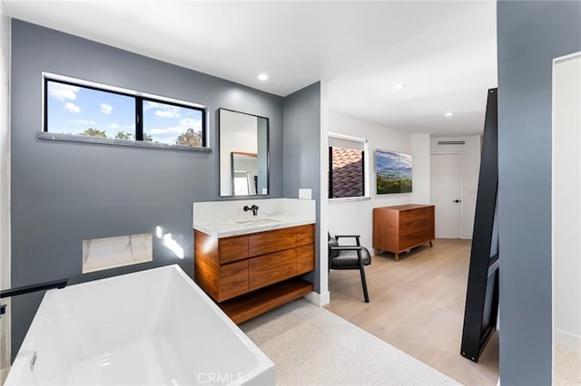 45 Morena, Irvine, CA 92612 - full bath featuring a freestanding bath, vanity, and recessed lighting