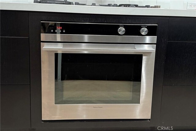45 Morena, Irvine, CA 92612 - kitchen view of oven and dark cabinets