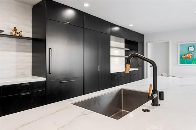 45 Morena, Irvine, CA 92612 - kitchen view of dark cabinets, open shelves, recessed lighting, and light stone countertops