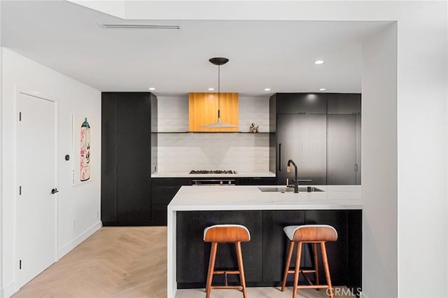 45 Morena, Irvine, CA 92612 - kitchen with a kitchen bar, a peninsula, hanging light fixtures, modern cabinets, and backsplash