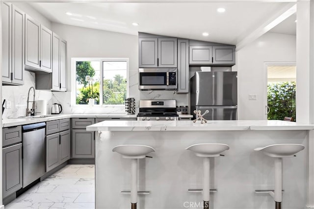 6535 Mary Ellen Ave, Valley Glen, CA 91401 - kitchen with stainless steel appliances, gray cabinets, plenty of natural light, light marble finish floors, and recessed lighting