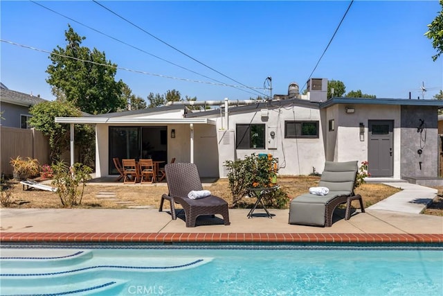 6535 Mary Ellen Ave, Valley Glen, CA 91401 - back of house with a patio, stucco siding, and an outdoor pool