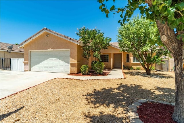 43733 6th St E, Lancaster, CA 93535 - single story home with a garage, stucco siding, driveway, and a tile roof