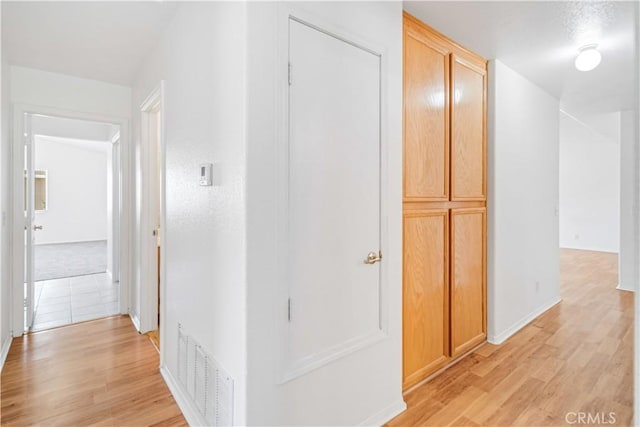 43733 6th St E, Lancaster, CA 93535 - hallway featuring light wood-type flooring and baseboards