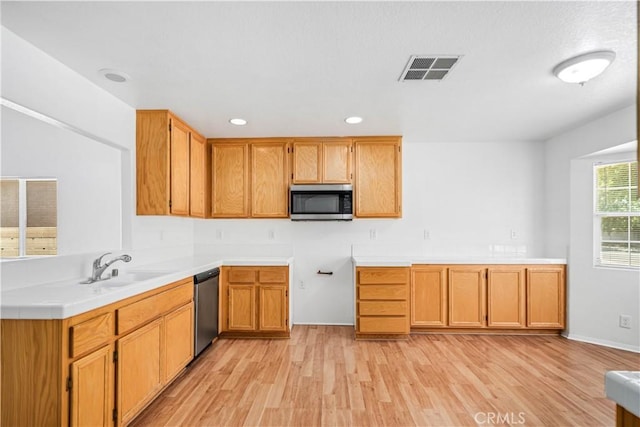 43733 6th St E, Lancaster, CA 93535 - kitchen with stainless steel appliances, light wood-type flooring, light countertops, and recessed lighting