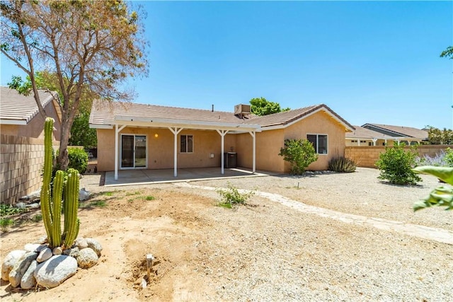 43733 6th St E, Lancaster, CA 93535 - back of house featuring stucco siding, a patio, and a tiled roof