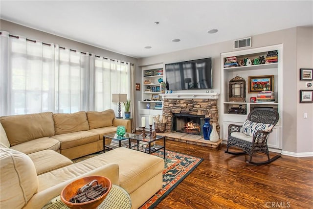 512 Golden W Dr, Redlands, CA 92373 - living room with wood finished floors, a fireplace, and built in shelves