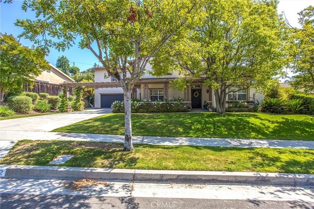 512 Golden W Dr, Redlands, CA 92373 - view of front of house with driveway, a front yard, and stucco siding