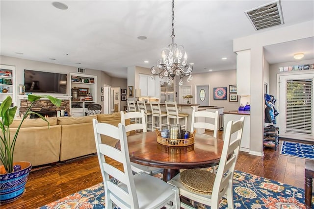 512 Golden W Dr, Redlands, CA 92373 - dining room with wood finished floors, a fireplace, recessed lighting, and a chandelier