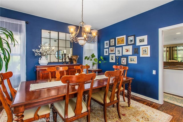 512 Golden W Dr, Redlands, CA 92373 - dining area with a chandelier, plenty of natural light, and wood finished floors