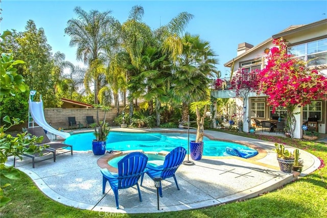 512 Golden W Dr, Redlands, CA 92373 - view of pool featuring a patio area, a water slide, and a fenced backyard