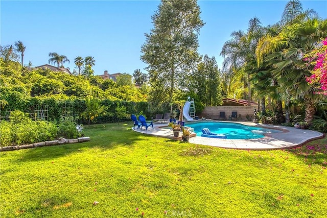 512 Golden W Dr, Redlands, CA 92373 - view of swimming pool featuring a water slide, a patio area, and a fenced backyard