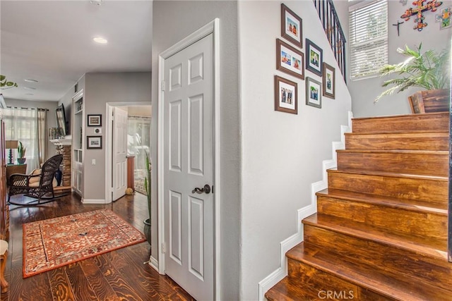 512 Golden W Dr, Redlands, CA 92373 - stairs with wood finished floors, recessed lighting, and a fireplace