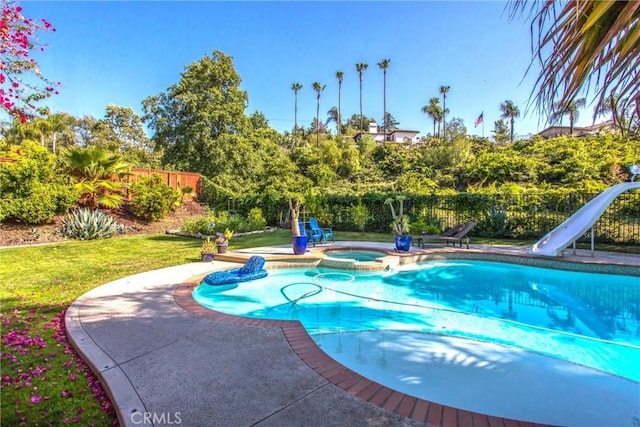 512 Golden W Dr, Redlands, CA 92373 - view of pool featuring a water slide, a fenced backyard, a pool with connected hot tub, and a patio
