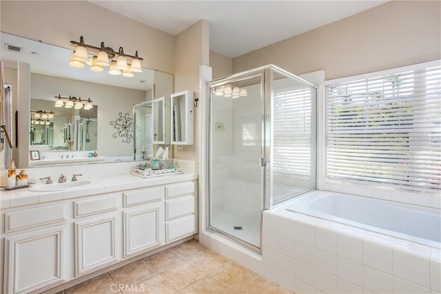 512 Golden W Dr, Redlands, CA 92373 - full bathroom with tile patterned flooring, vanity, a garden tub, and a shower stall